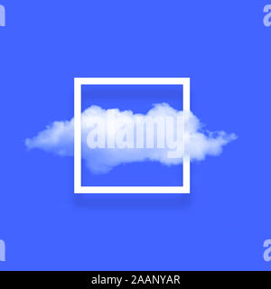 White cloud in snapshot frame illustration. Rectangular border with cotton candy isolated on bright blue color background. Creative artistic compositi Stock Photo