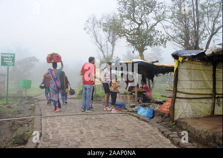 Pune; Maharashtra India; Sept. 2015: Southeast Asia - Indian Family enjoying snacks at sinhagad fort pune Stock Photo