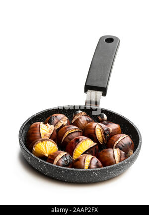 Roasted chestnut in frying pan on black stone background Stock Photo - Alamy