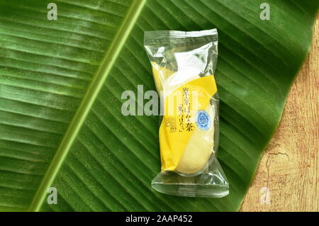 Bangkok Thailand November 23, 2019 : sponge cake stuffed banana cream called Tokyo banana on leaf fovatite souvenir from Japan Stock Photo