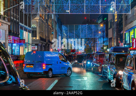LONDON - NOVEMBER 21, 2019: Christmas lights on Oxford Street in London feature 27 energy efficient LED light curtains draped over the length of the s Stock Photo