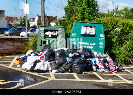 Warminster, Wiltshire / UK - August 20 2019: An overflowing clothing bank in the Warminster Central Car Park in Wiltshire, England, UK Stock Photo
