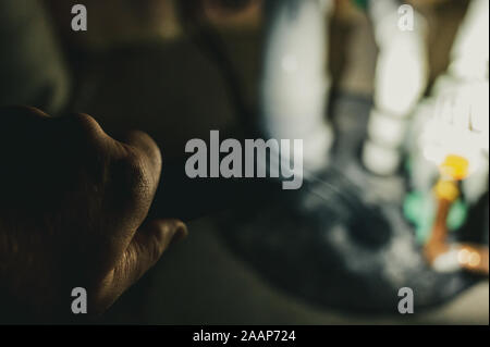 Vintage filter of flashlight shining light on sump pump system Stock Photo