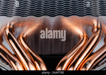 modern tower heat radiator with six copper heatpipes close-up macro background with selective focus and blur. Stock Photo