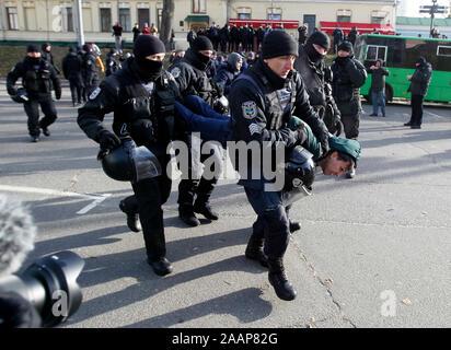 Policemen arrest a far-right activist during the march.Transgender rights activists in Ukraine’s capital Kyiv held a march to mark Transgender Day of Remembrance. In 2018, the police failed to protect those participating in a similar march from attacks by violent groups advocating hatred and discrimination. This year, there is a serious risk of new attacks and the police must ensure people can safely exercise their rights to freedom of peaceful assembly and expression without discrimination. Stock Photo