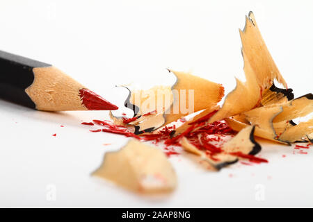 Red pencil  with shavings isolated on a white background Stock Photo