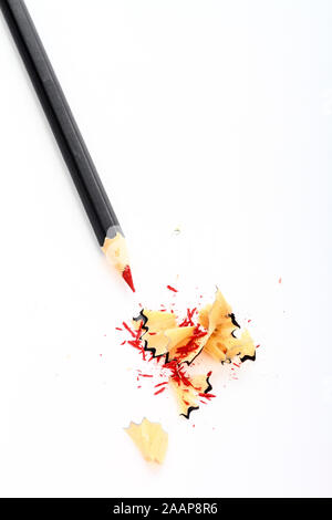 Red pencil  with shavings isolated on a white background Stock Photo