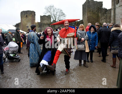Ludlow, Shropshire, UK. 23rd November 2019. Ludlow Medieval Christmas Fayre 23rd November 2019 held in the grounds of ancient castle. Jester dancing in the mud. Credit: David Bagnall/Alamy Live News Stock Photo