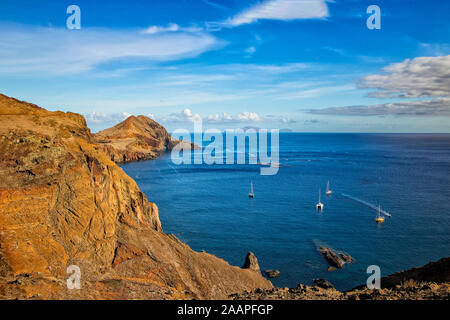 View of the bay in Ponta de Sao Lourenco, the island of Madeira, Portugal. There are rocky cliffs and clear water of the Atlantic Ocean with white Stock Photo