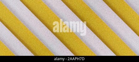 golden and silver diagonaly  striped textured background with plastic 3d effect Stock Photo