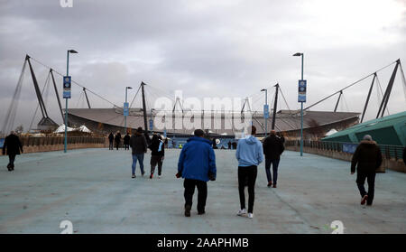Fans arrive ahead of the Premier League match at the Etihad Stadium, Manchester.
