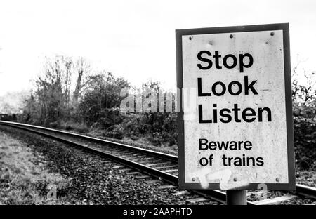 Beware of trains - rural rail pedestrian crossing near Frome, Somerset UK Stock Photo