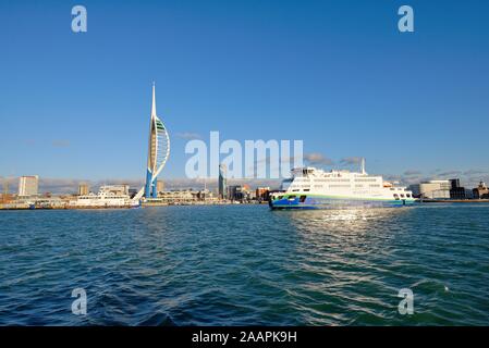 The waterfront of Portsmouth viewed from the harbour with the Emirates Spinnaker tower on Gunwharf Quays Portsmouth Hampshire UK