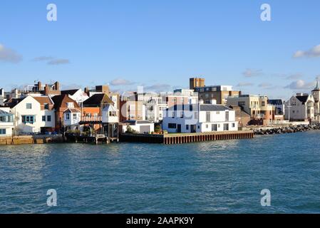 The old and historic buildings by the entrance to Portsmouth harbour as viewed from a passing boat Hampshire England UK Stock Photo