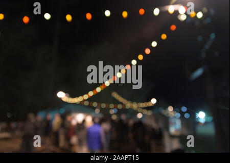 Multi-colored bokeh balls against a dark background Stock Photo