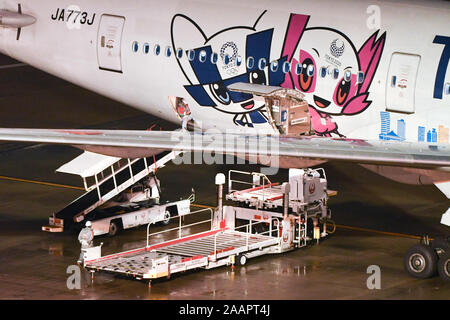 Tokyo, Japan. 23rd Nov, 2019. A Japan AirLine airplane can be seen with the logo of the Tokyo 2020 Olympics at Haneda International Airport in Tokyo, Japan on November 23, 2019 as its cargo been loaded. On the same day Pope Francis arrived in Japan on a Thai commercial airplane from Bangkok. According to a Management staff of Thai airline pope Francis arrives on a windy and rainy afternoon in which approximately twenty staff members from Thai airline and others welcome him to Japan. Photo taken on Saturday November 23, 2019. Photo by: Ramiro Agustin Vargas Tabares (Credit Image: © Ramiro Ag Stock Photo