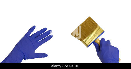 Gloved hand with paint brush white isolated background Stock Photo