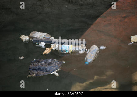 Plastic drinks bottles and other rubbish floating in Brixham Harbour. Devon England UK GB Stock Photo