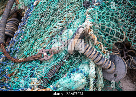 Fishing nets and crabbing crates sit on the docks of Whitby, United Kingdom. Stock Photo