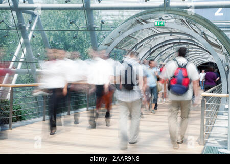 Business people walking through the tunnel, modern architecture Stock Photo