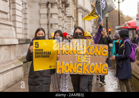 London, UK. 23rd Nov, 2019. Democracy for Hong Kong demonstration. The protesters are urging the UK Government to act on China's breaches of the Sino-British Joint Declaration, raise awareness of Hong Kong's humanitarian crisis and widespread injustices and erosion of autonomy in the city. Penelope Barritt/Alamy Live News Stock Photo