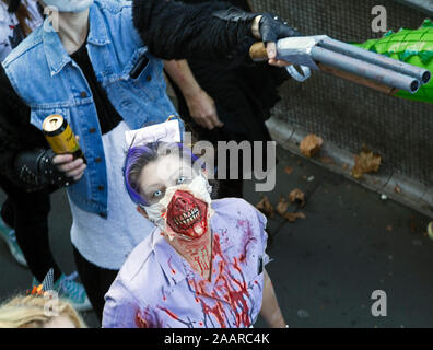 A participant in the annual Bristol Zombie Walk dressed as a nurse and wearing gory makeup in Bristol, UK on 31 October 2015. Stock Photo