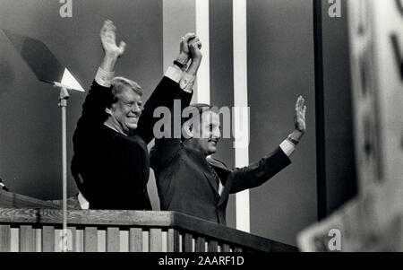 New York, New York, USA. 07th July, 1976. Presidential candidate JIMMY CARTER, left, and his VP choice WALTER MONDALE raise their arms in unison at the National Democratic Party Convention NYC in Madison Square Garden. Credit: Keystone Pictures USA/ZUMAPRESS.com/Alamy Live News Stock Photo