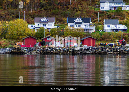 Norwegian town near a fjord with a forest behind Stock Photo