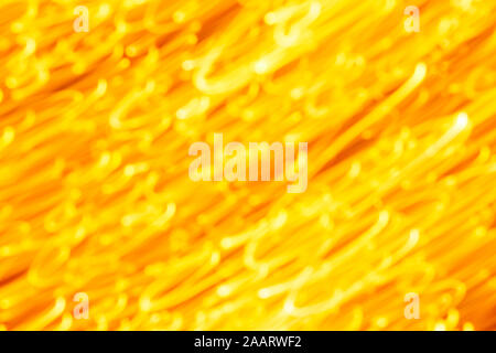 Futuristic blurred lights holiday monochrome background in yellow. Horizontal, soft focus Stock Photo
