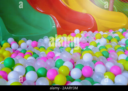 Colored balls and slider for kids in the playground Stock Photo