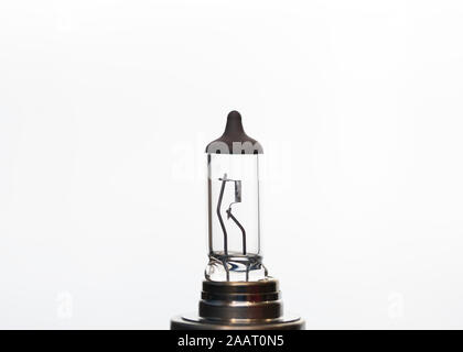 Automotive used halogen headlight bulb closeup isolated Stock Photo