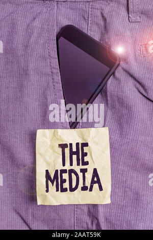 Handwriting text writing The Media. Conceptual photo main means of mass communication that are regarded collectively Smartphone device inside formal w Stock Photo