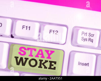 Text sign showing Stay Woke. Business photo text being aware of your surroundings and things going on Keep informed Stock Photo