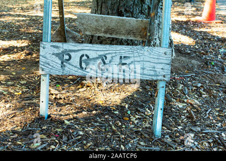 PGE sign of Pacific Gas and Electric Company on weathered folding construction, maintenance barricade - San Francisco, California, USA - Circa 2019 Stock Photo