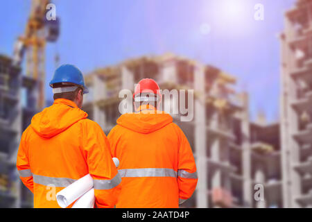 Two engineers looking at consrtuction site Stock Photo