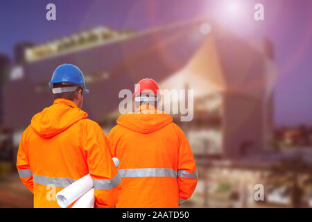 Two engineers looking at consrtuction site Stock Photo