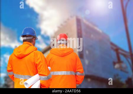 Two engineers looking at consrtuction site Stock Photo