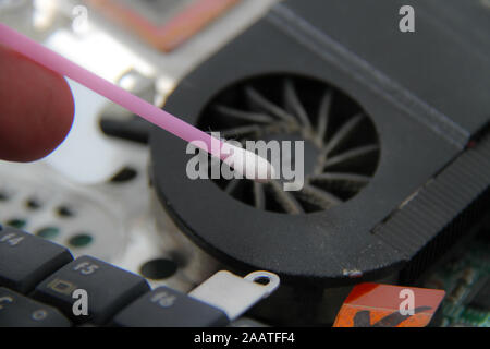 Computer repair concept Close-up view. Computer service. Man repairing notebook at the table Stock Photo