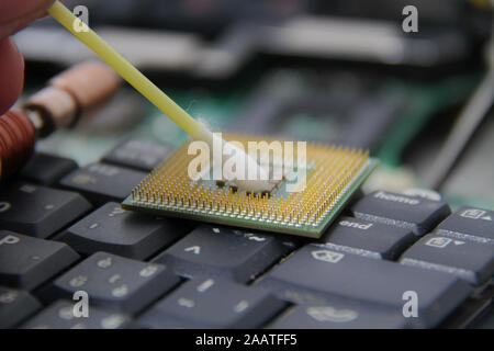 Computer repair concept Close-up view. Computer service. Man repairing notebook at the table Stock Photo