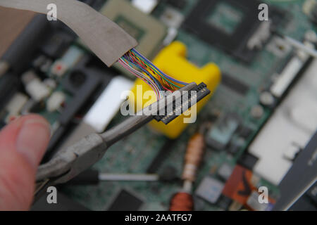 Computer repair concept Close-up view. Computer service. Man repairing notebook at the table Stock Photo
