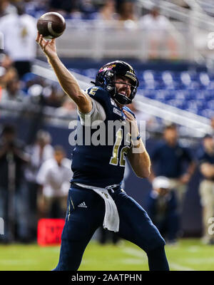 FIU quarterback James Morgan (12) his sacked by Miami defensive lineman ...