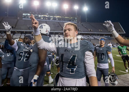 Houston, TX, USA. 23rd Nov, 2019. Rice Owls quarterback Tom Stewart (14) celebrates the victory after an NCAA football game between the North Texas Mean Green and the Rice Owls at Rice Stadium in Houston, TX. Rice won the game 20 to 14.Trask Smith/CSM/Alamy Live News Stock Photo