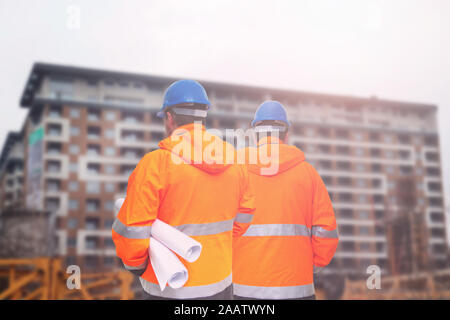 Two engineers looking at consrtuction site Stock Photo