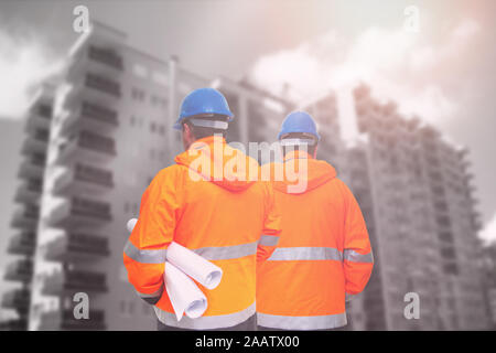 Two engineers looking at consrtuction site Stock Photo