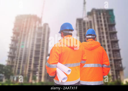 Two engineers looking at consrtuction site Stock Photo