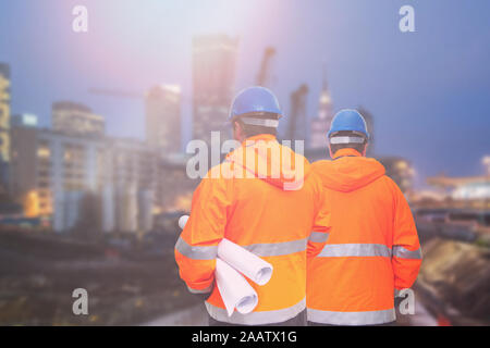 Two engineers looking at consrtuction site Stock Photo