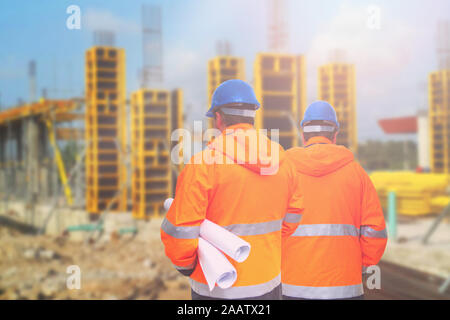 Two engineers looking at consrtuction site Stock Photo