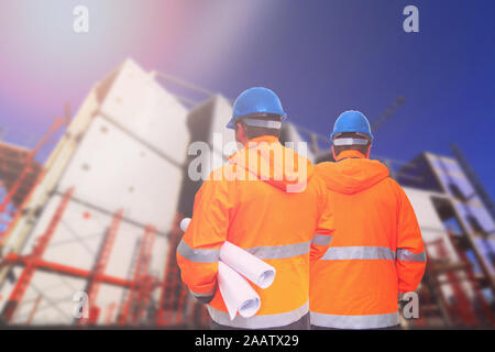 Two engineers looking at consrtuction site Stock Photo