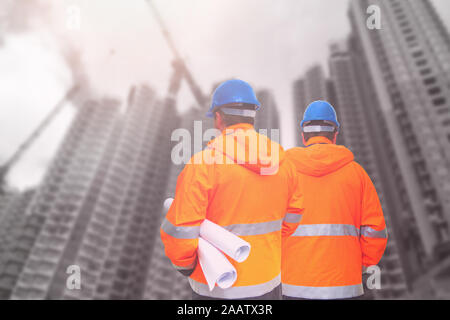 Two engineers looking at consrtuction site Stock Photo