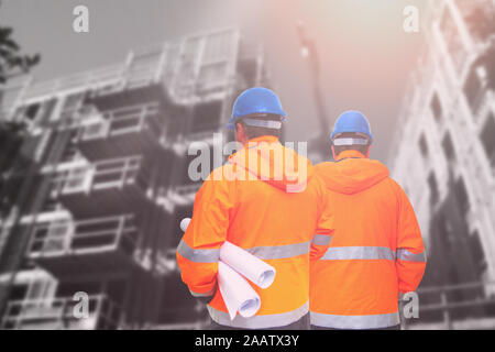 Two engineers looking at consrtuction site Stock Photo